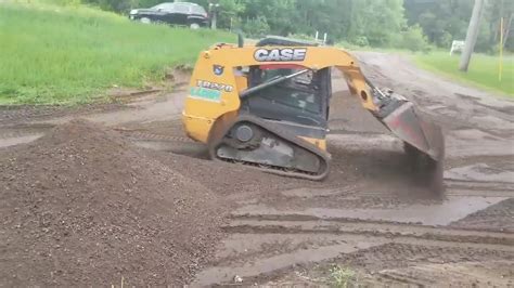 grading with skid steer|grading driveway with skid steer.